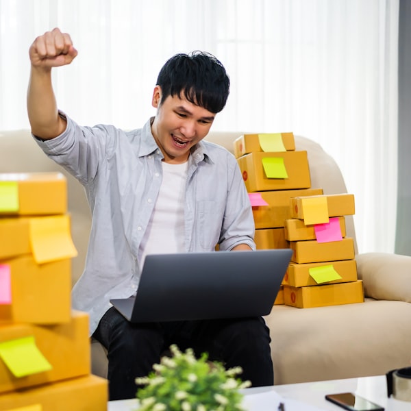 Portrait of a team member unboxing a new laptop