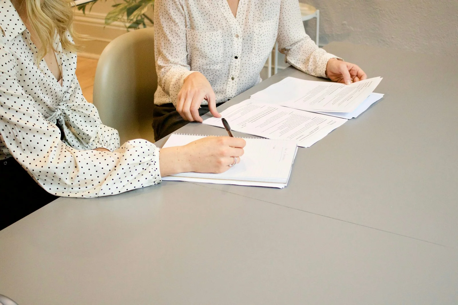 Signing a contractor agreement in warm natural light