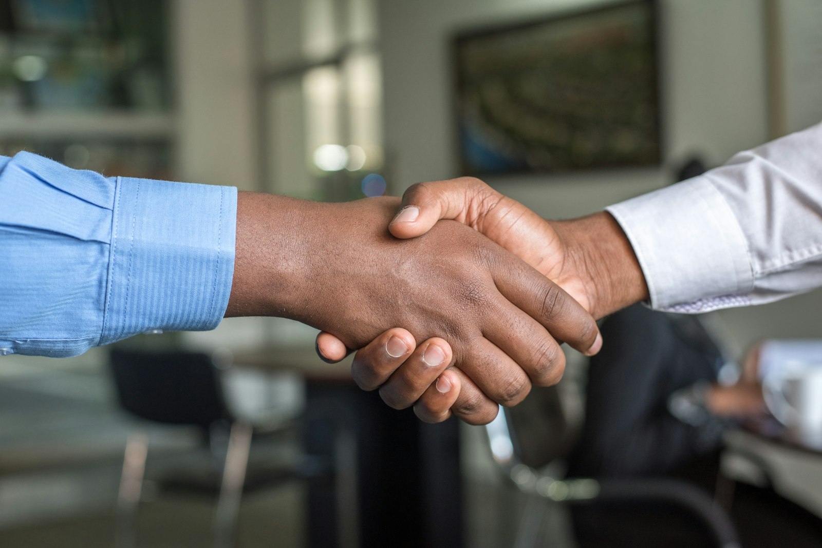 Recruiter welcoming a candidate with a handshake